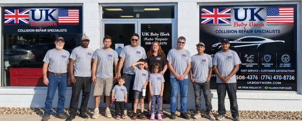 UK Body Work collision repair team outside the Hyannis auto body shop